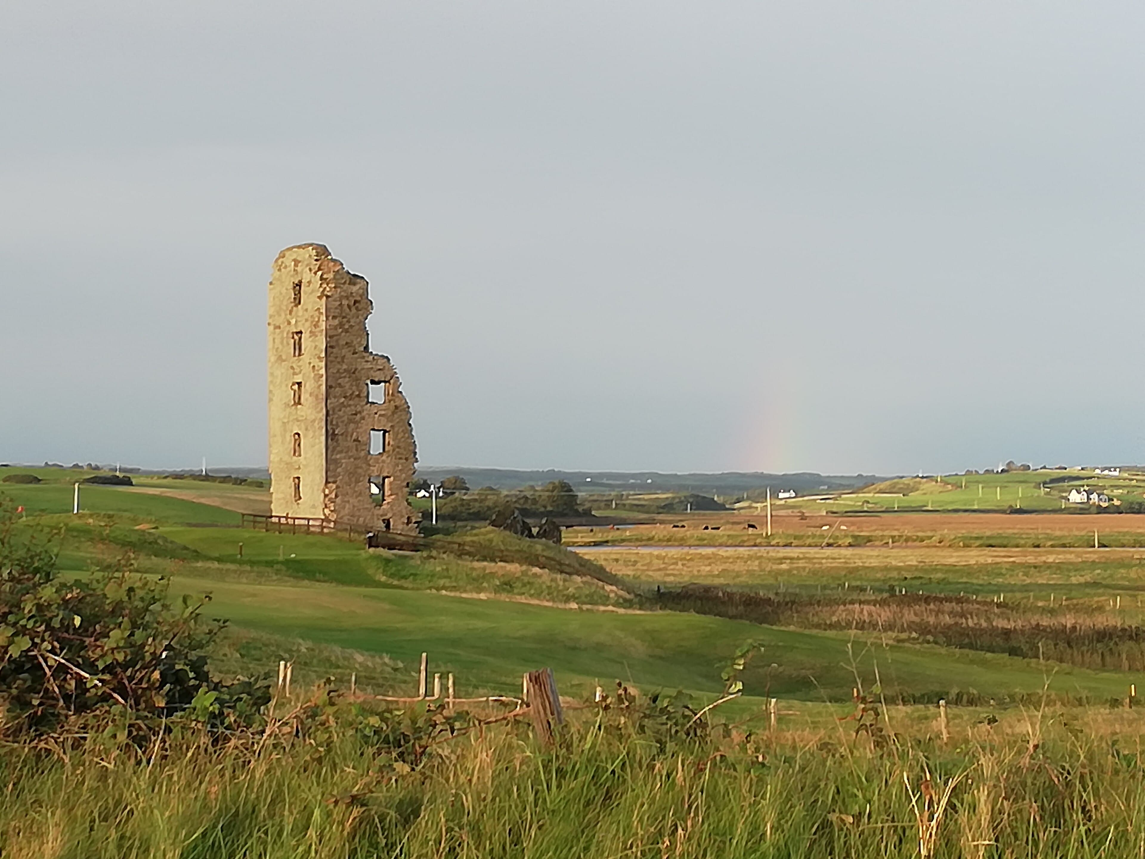 The ruined castle beside the links at Lahinch Golf Club, County Clare, Ireland