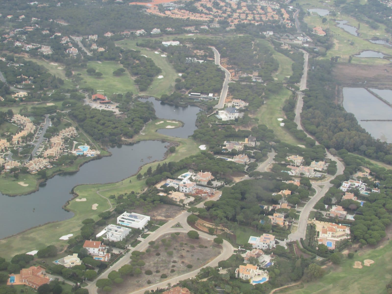 San Lorenzo Golf Course aerial view bordering the Ria Formosa lagoon, Algarve, Portugal
